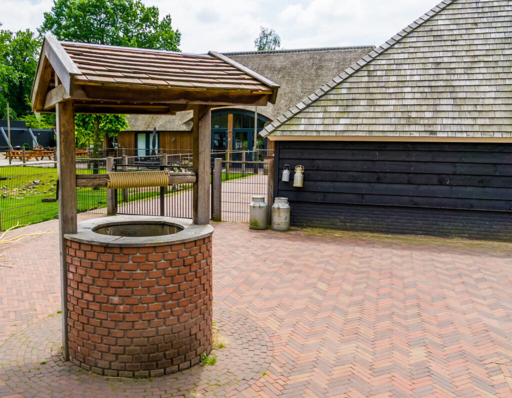 Water Well Repair Fort Collins CO - New Installations 1 a brick structure with a water fountain in the middle of it