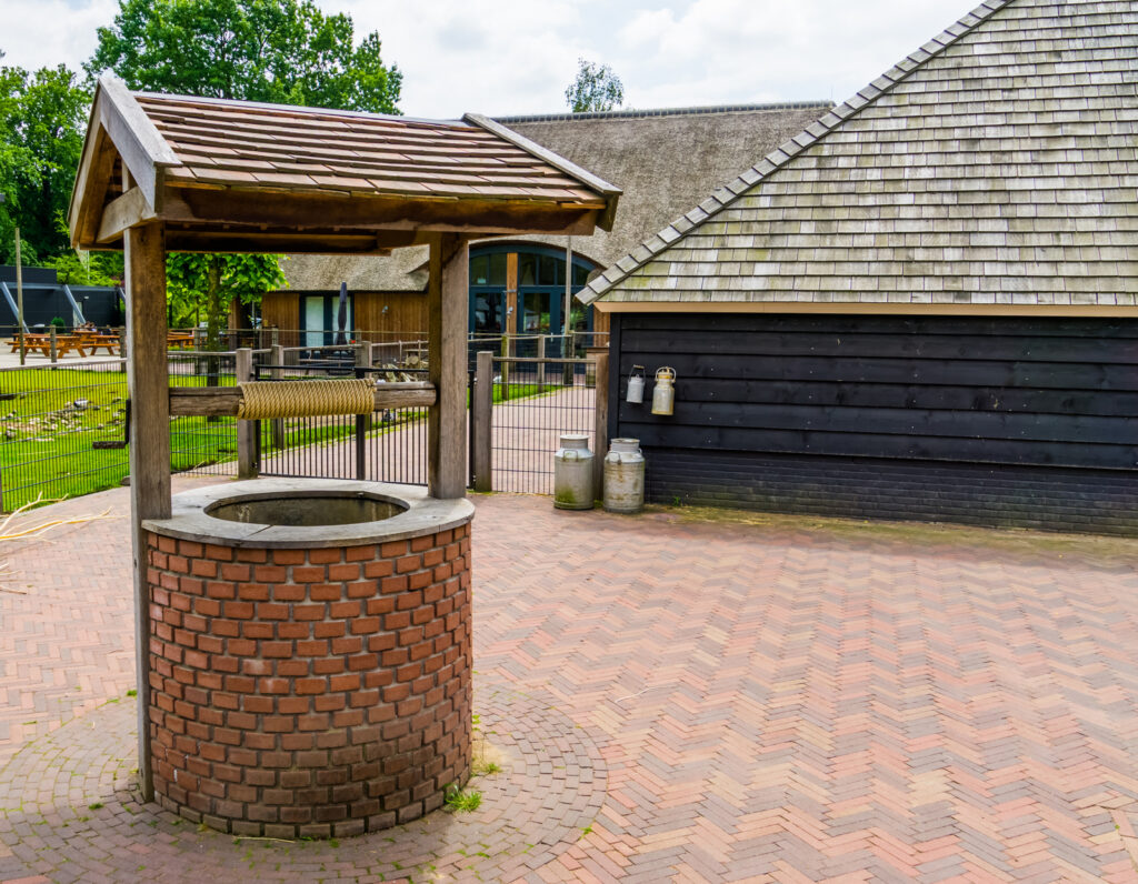 a brick structure with a water fountain in the middle of it